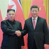 Chủ tịch Trung Quốc Tập Cận Bình (phải) và nhà lãnh đạo Triều Tiên Kim Jong-un trong cuộc gặp tại Bắc Kinh ngày 8/1/2019. (Nguồn: AFP/TTXVN) 