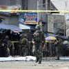 Cảnh sát và binh sỹ phong tỏa hiện trường một vụ đánh bom ở Jolo, tỉnh Sulu, Philippines. (Nguồn: AFP/TTXVN) 