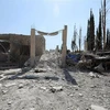 Hiện trường một vụ không kích ở Tây Bắc Syria. (Nguồn: AFP/TTXVN) 