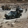 Lực lượng an ninh Afghanistan trong một chiến dịch truy quét phiến quân. (Nguồn: AFP/TTXVN) 