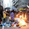 Người biểu tình đốt phá tại một tuyến phố ở Hong Kong (Trung Quốc) ngày 15/9/2019. (Nguồn: THX/TTXVN) 