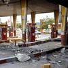Một trạm xăng bị người biểu tình đốt phá tại Eslamshahr, Iran. (Nguồn: AFP/TTXVN) 