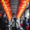 Người dân đeo khẩu trang đề phòng lây nhiễm virus corona gây dịch bệnh viêm phổi tại Macau, Trung Quốc ngày 22/1/2020. (Nguồn: AFP/TTXVN) 