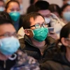 Nhân viên y tế từ thành phố Thượng Hải tham dự khóa đào tạo về dịch bệnh phổi do virus corona mới gây ra tại Vũ Hán, tỉnh Hồ Bắc, Trung Quốc, ngày 25/1. (Nguồn:THX/TTXVN) 