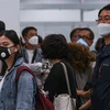 Người dân đeo khẩu trang để phòng tránh lây nhiễm virus corona chủng mới tại sân bay quốc tế Kuala Lumpur ở Sepang, Malaysia, ngày 29/1/2020. (Nguồn: AFP/TTXVN) 