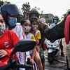 Người dân đeo khẩu trang phòng lây nhiễm COVID-19 tại Bangkok, Thái Lan ngày 22/5/2020. (Nguồn: AFP/TTXVN) 