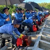 Lễ truy điệu, cải táng 52 hài cốt liệt sỹ tại Nghĩa trang liệt sỹ Tam Nông (Đồng Tháp). (Ảnh: Chương Đài/TTXVN) 