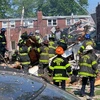 Lực lượng cứu hỏa nỗ lực khắc phục hậu quả vụ nổ lớn ở khu dân cư trên phố Reistertown, thành phố Baltimore, bang Maryland (Mỹ) ngày 10/8/2020. (Nguồn: NBC/TTXVN) 