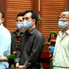 Các bị cáo cầm đầu vụ án Nguyễn Khanh, Nguyễn Minh Tấn (từ phải qua) tại phiên xét xử. (Ảnh: Thành Chung/TTXVN) 