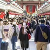 Người dân đeo khẩu trang phòng lây nhiễm COVID-19 tại Tokyo, Nhật Bản, ngày 28/11/2020. (Nguồn: Kyodo/TTXVN) 