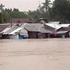Nhà cửa chìm trong biển nước do bão Dujuan tại tỉnh Surigao del Su, Philippines ngày 21/2/2021. (Nguồn: AFP/TTXVN) 