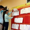 Danh sách người ứng cử Đại biểu Quốc hội khóa XV và Hội đồng Nhân dân được niêm yết công khai tại trụ sở xã Phú Thịnh, huyện Yên Bình, tỉnh Yên Bái. (Ảnh: Việt Dũng/TTXVN) 
