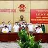 Lễ ký kết chuyển giao nhà tài trợ CLB bóng đá Sông Lam Nghệ An giữa Tập đoàn Tân Long và Ngân hàng TMCP Bắc Á. (Ảnh: Tá Chuyên/TTXVN) 