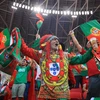 Cổ động viên Bồ Đào Nha mừng chiến thắng. (Ảnh: AFP/TTXVN) 