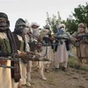 Các tay súng Taliban được vũ trang hạng nặng tại một địa điểm chưa xác định ở thành phố Ghazni, Đông Nam Afghanistan. (Ảnh: AP/TTXVN) 