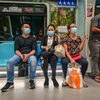 Người dân đeo khẩu trang phòng lây nhiễm COVID-19 tại Kuala Lumpur, Malaysia. (Ảnh: THX/TTXVN) 