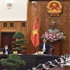 [Photo] Thủ tướng Phạm Minh Chính chủ trì cuộc họp về vaccine COVID-19