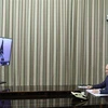 Tổng thống Nga Vladimir Putin (phải) và Tổng thống Mỹ Joe Biden (ảnh màn hình) tại cuộc họp trực tuyến ngày 7/12/2021. (Ảnh: AFP/TTXVN) 