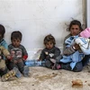 Phụ nữ và trẻ em Syria tại trại tị nạn al-Hol ở tỉnh Hasakeh, miền Đông Bắc Syria. (Ảnh: AFP/TTXVN) 