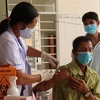 Tiêm vaccine phòng COVID-19 cho người dân xã miền núi Đăng Hà, huyện Bù Đăng, tỉnh Bình Phước. (Ảnh: Sỹ Tuyên/TTXVN) 