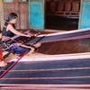 Phụ nữ dân tộc Jrai, làng Kép 2, xã Ia Mơ Nông, huyện Chư Păh (Gia Lai) giữ nghề dệt thổ cẩm để bảo tồn văn hóa dân tộc. (Ảnh: Hồng Điệp/TTXVN)