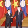 [Photo] Chủ tịch Quốc hội Vương Đình Huệ hội kiến Thủ tướng Lào