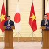 Thủ tướng Phạm Minh Chính và Thủ tướng Nhật Bản Kishida Fumio. (Ảnh: Dương Giang/TTXVN) 