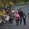 Người di cư di chuyển qua Oaxaca (Mexico) trong hành trình tới Mỹ, ngày 15/11/2021. (Ảnh: AFP/TTXVN) 