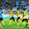 Các cầu thủ U23 Malaysia vỡ oà cảm xúc chiến thắng sau khi trận đấu kết thúc. (Ảnh: Tuấn Anh/TTXVN) 