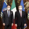 Ông Giuseppe Conte, lãnh đạo M5S và Thủ tướng Mario Draghi. (Ảnh: AFP/TTXVN) 