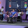 Nữ đô cử Châu Hoàng Tuyết Loan giành Huy chương Vàng hạng cân 55kg với mức cử 104kg, vượt kỷ lục cũ đúng 1kg. (Ảnh: TTXVN phát) 