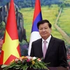 Tổng Bí thư, Chủ tịch nước Lào Thongloun Sisoulith trả lời phỏng vấn báo chí Việt Nam và Lào. (Ảnh: Phạm Kiên/TTXVN) 