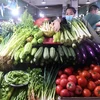 Người dân chọn mua rau củ tại một siêu thị ở Khu tự trị dân tộc Choang Quảng Tây, Trung Quốc ngày 9/7/2022. (Ảnh: THX/TTXVN) 