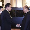 Chủ tịch nước Nguyễn Xuân Phúc và Thủ tướng Nhật Bản Kishida Fumio. (Ảnh: Thống Nhất/TTXVN) 