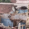 Nhà ở của người dân huyện Bình Sơn bị hư hại sau bão số 4. (Ảnh: TTXVN phát) 