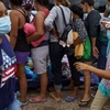 Người di cư tập trung tại thị trấn biên giới Reynosa, Tamaulipas, Mexico, trong hành trình tới Mỹ. (Ảnh: AFP/TTXVN) 