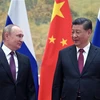 Tổng thống Nga Vladimir Putin (trái) và Chủ tịch Trung Quốc Tập Cận Bình tại cuộc gặp ở Bắc Kinh, ngày 4/2/2022. (Ảnh: AFP/TTXVN)