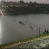 Hiện trường vụ sập cầu trên sông Machchhu ở Morbi, bang Gujarat, Ấn Độ, ngày 30/10/2022. (Ảnh: ANI/TTXVN) 