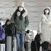 Hành khách trên các chuyến bay xuất phát từ Trung Quốc đại lục cũng sẽ bắt buộc đeo khẩu trang. (Nguồn: Kyodo)