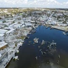 Cảnh đổ nát sau bão Ian tại bãi biển Fort Myers ở Florida, Mỹ, ngày 30/9/2022. (Ảnh: THX/TTXVN) 