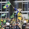 Người biểu tình ủng hộ cựu Tổng thống Brazil Jair Bolsonaro đột nhập Dinh Tổng thống đương nhiệm ở Brasilia, ngày 8/1/2023. (Ảnh: AFP/TTXVN)