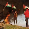Người biểu tình Palestine tập trung tại thành phố Gaza, phản đối vụ binh sỹ Israel sát hại ít nhất 9 người Palestine ở Khu Bờ Tây, ngày 26/1/2023. (Ảnh: THX/TTXVN)