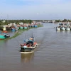 Tàu cá của ngư dân neo đậu trên sông Cái Bé thuộc địa bàn huyện Châu Thành, Kiên Giang. (Ảnh: Lê Huy Hải/TTXVN)