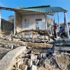 Căn nhà của anh Trần Văn Châu ở khu phố Ninh Chữ 1, thị trấn Khánh Hải (Ninh Hải, Ninh Thuận) bị sóng biển đánh hư hỏng nặng. (Ảnh: Nguyễn Thành/TTXVN)