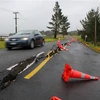 Một đoạn đường bị hư hại do bão Gabrielle tại Auckland, New Zealand ngày 14/2/2023. (Ảnh: THX/TTXVN)