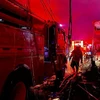 Nhân viên cứu hỏa nỗ lực khống chế đám cháy tại một trạm nhiên liệu ở Plumpang, phía Bắc thủ đô Jakarta, Indonesia, ngày 3/3/2023. (Ảnh: AFP/TTXVN)