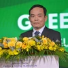 Ông Trần Lưu Quang, Ủy viên Ban chấp hành Trung ương Đảng, Phó Thủ tướng Chính phủ, phát biểu tại diễn đàn. (Ảnh: Quốc Dũng/TTXVN)