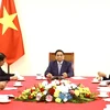 Thủ tướng Phạm Minh Chính điện đàm với Thủ tướng Trung Quốc Lý Cường. (Ảnh: Lâm Khánh/TTXVN)