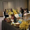 Các sản phẩm gạo tiêu biểu của Việt Nam được giới thiệu tại hội thảo. (Ảnh: Mạc Luyện/TTXVN)