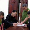 Cơ quan Công an làm việc với Phạm Xuân Thanh (trái) và Đới Quang Lưu. (Nguồn: Báo Lâm Đồng)